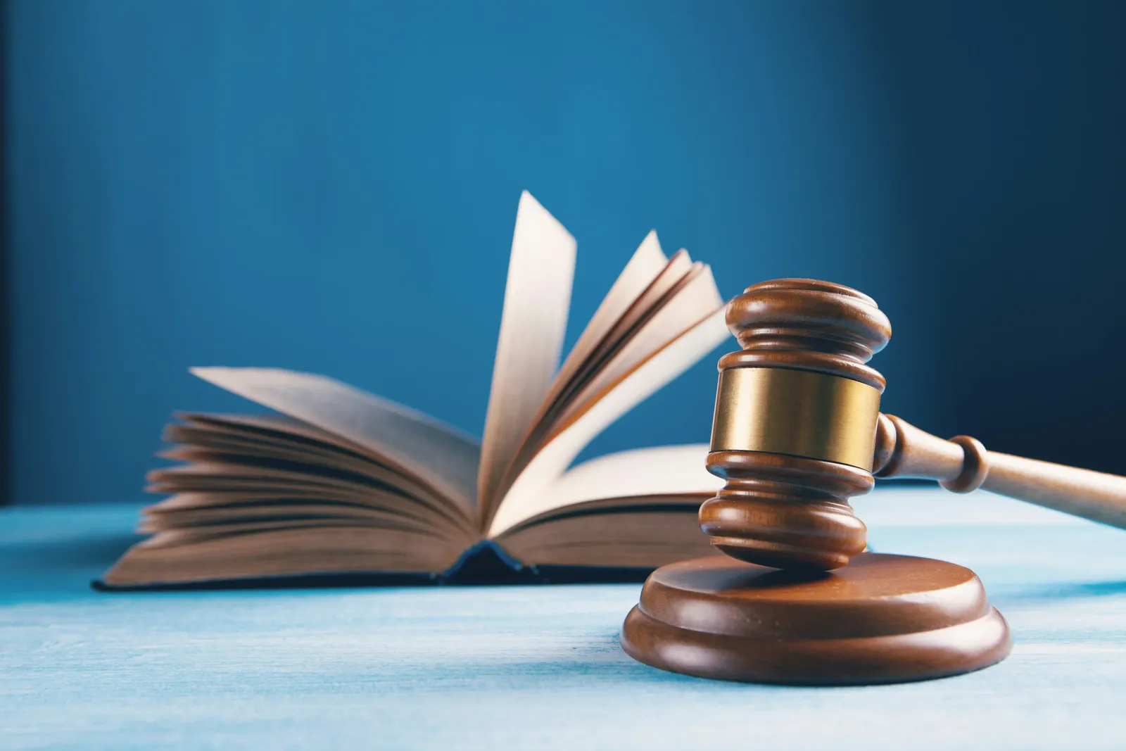 Judge gavel beside an open legal book